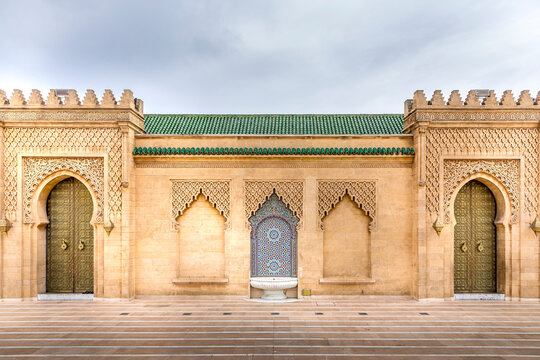 Rabat, Morocco - March 23, 2024: A traditional fountain and door decorated in morrocan and islamic design at the Hassan tower and mosque in Rabat, Morocco