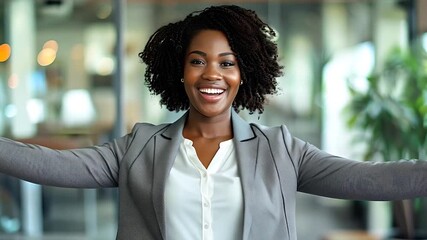 A cheerful professional woman opens her arms wide in a welcoming gesture inside a bright office space. AI