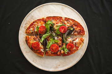 Top-down view of bruschetta topped with crispy pancetta, fresh tomatoes, and basil, emphasizing vibrant colors and textures. Ideal for menu designs, food blogs, or Italian cuisine promotions