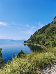 Summer landscape with mountains and reflection on Circum-Baikal Railway