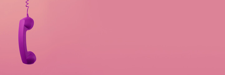 Purple corded telephone handset on pink background. Banner design with space for text
