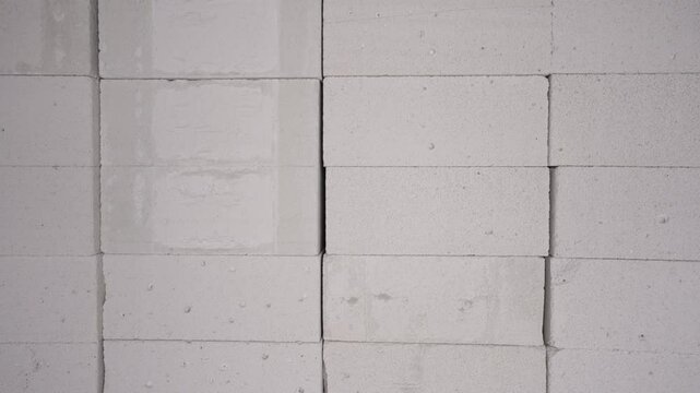 Camera moving right showing stacks of concrete blocks
