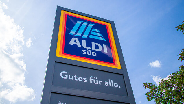 Commercial sign of ALDI S&uuml;d Store against slightly clouded sky in 2024. ALDI is a large discount supermarket chain in Germany.