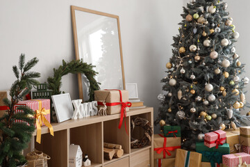 Christmas decor with presents on shelf in light living room interior