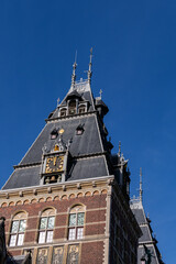 Fototapeta premium Side of the Rijksmuseum building (1885), seen from the Ruysdaelkade. Amsterdam Rijksmuseum holds many masterpiece paintings of Dutch and world art. Amsterdam, the Netherlands.