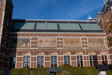 Obraz premium Side of the Rijksmuseum building (1885), seen from the Ruysdaelkade. Amsterdam Rijksmuseum holds many masterpiece paintings of Dutch and world art. Amsterdam, the Netherlands.
