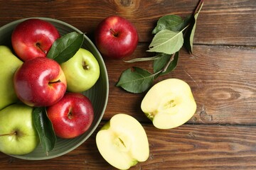 Fresh red and green apples on wooden table, flat lay