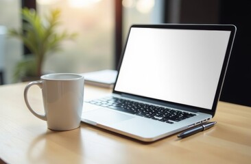 Fototapeta premium A serene workspace featuring a laptop, coffee mug, and a pen on a wooden desk beside a window with soft natural light