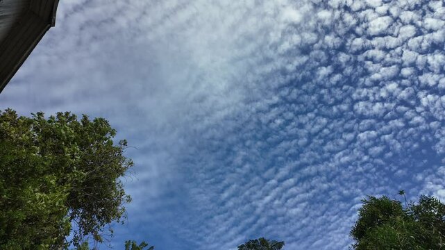 time lapsed cirrocumulus clouds in the blue sky