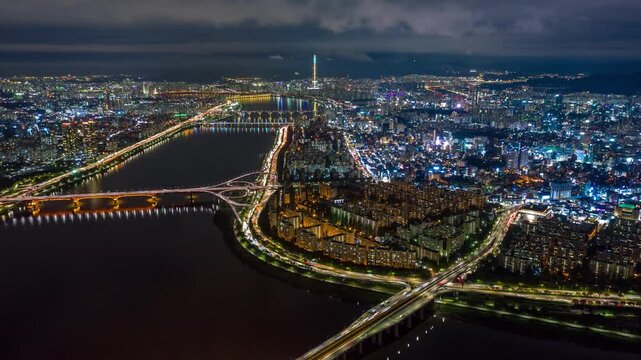 SEOUL, SOUTH KOREA - SEPTEMBER 9, 2024: Captivating night lights illuminate the Han River and city skyline, showcasing urban beauty and vibrant life