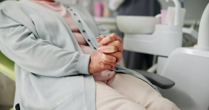 Woman, patient or hands with nerves at dental surgery for tooth extraction or pain relief at clinic. Closeup, female person or customer waiting in anticipation, anxiety or stress for dentist on chair