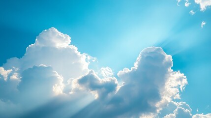 serene sky filled with fluffy white clouds against a bright blue backdrop, creating a peaceful and airy atmosphere.