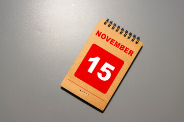 15 November on wooden grey cubes. Calendar cube date 15 November.