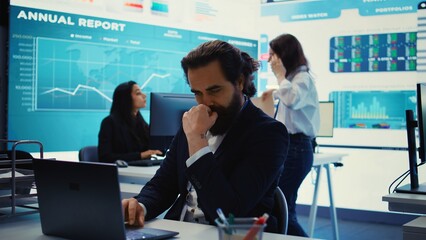 Naklejka premium Executive officer analyzing infographics on sales to evaluate supply and demand, find ways of increasing organizational funds and develop the business globally. Strategic objectives. Camera B.