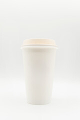 simple marketing close up of white cup of coffee with blank space for text or logo