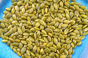 Close-up of roasted pumpkin seeds with salt.