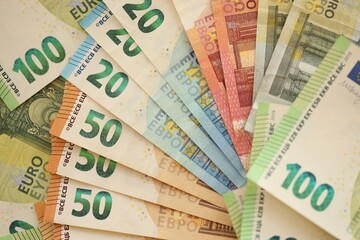 Pile of euro paper banknotes as finance background