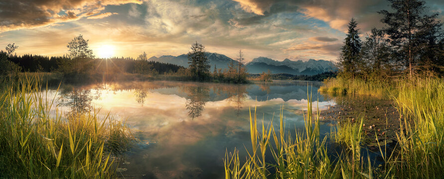 Dreamland scenery sunset with colorful sky at a lake