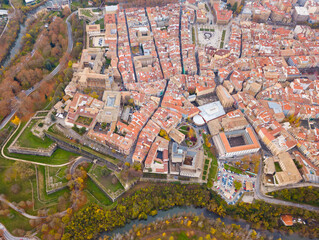 View from drone of medieval town of Pamplona in valley of Arga river, Navarre, Spain..