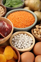 Different products rich in iron on table, closeup