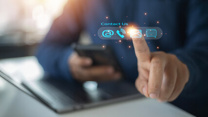 Naklejka premium Reach out via customer support hotline, Business professionals use virtual screen icons (email, live chat, telephone) for fast, efficient customer service and online helpdesk assistance.