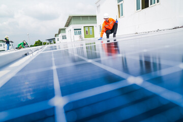 engineer man inspects construction of solar cell panel or photovoltaic cell by electronic device....