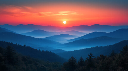 Obraz premium A breathtaking view of a mountain range at sunset, the sky ablaze with vibrant hues of orange and pink.