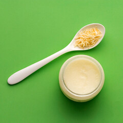 Grated Cocos nucifera in the spoon - Virgin coconut oil.