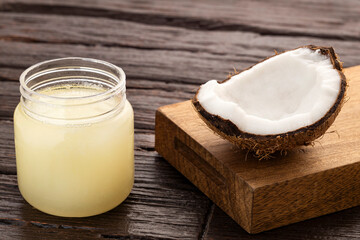 Bowl with oil and grated coconut - Cocos nucifera.