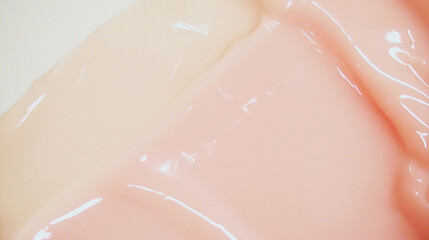 Fototapeta premium a close-up, top-down view of milky pink, smooth and glossy paint, filling the entire frame with a focus on the perfectly flat, silky texture of the surface