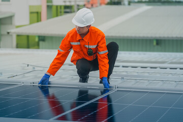 engineer man inspects construction of solar cell panel or photovoltaic cell by electronic device....