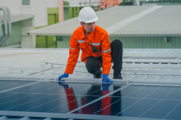 engineer man inspects construction of solar cell panel or photovoltaic cell by electronic device....