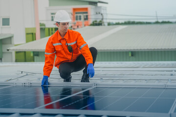 engineer man inspects construction of solar cell panel or photovoltaic cell by electronic device....