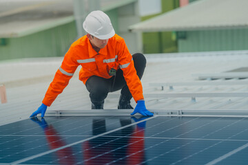 engineer man inspects construction of solar cell panel or photovoltaic cell by electronic device....