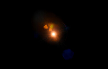 A bright light shines in the center of a dark background.