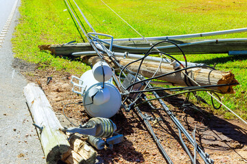 Tornado winds damaged fell down electric poles with wires during strong storm © ungvar