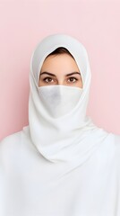 Naklejka premium Portrait of a fashionable woman wearing a white hijab or veil advocating for sustainable and eco friendly fashion The image is set against a clean minimalist solid background