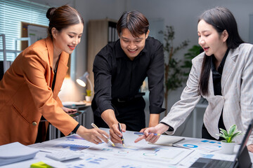 Business people analyzing financial chart using pen and digital tablet discussing new strategy in meeting room