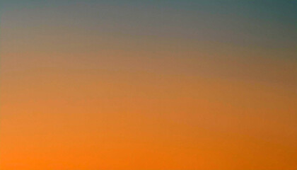 Fiery Hues of Sunset: A captivating gradient of orange and gray paints the evening sky, creating a breathtaking view.