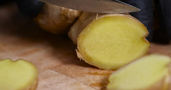 sliced ginger root on the table, details of the ginger root used in cooking sliced into pieces