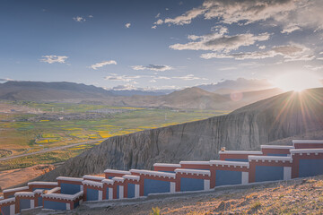 Sunset over the rapeseed fields around Sakya monastery, Western Tibet