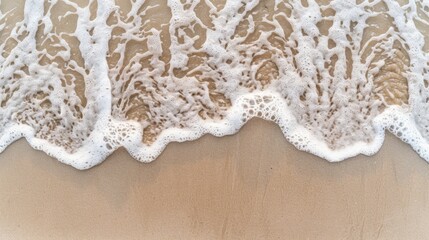 Obraz premium Calm Ocean Waves Gently Wash Over Sandy Shoreline