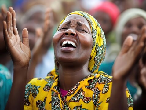 worshippers uplift their hands in joyous praise at a spirited gathering, radiating a sense of community and shared faith in a bright, vibrant setting