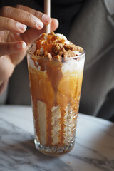 Indulge in a Delicious and Luxurious Layered Coffee Dessert Generously Topped with Treats