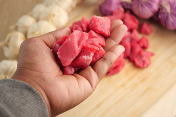 Fresh, uncooked meat pieces specifically meant for culinary preparation and cooking use