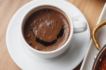a cup of turkish coffee on table 