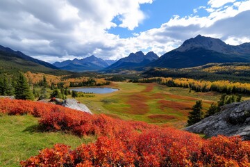 Fototapeta premium Autumn in the Rockies, with vibrant red and gold trees lining the slopes