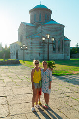A woman travels in the summer to historical sites of ancient architecture with nature