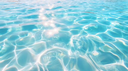 Fototapeta premium Sunlight reflecting off rippling blue water, creating mesmerizing patterns.