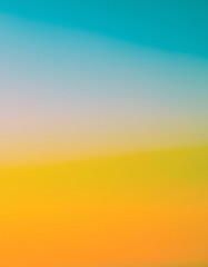 Fototapeta premium Vibrant Hues of a Sunset Sky: A breathtaking gradient of teal, yellow, and orange paints a serene, peaceful landscape.